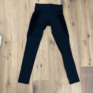 Michi leggings with fishnet pockets. Size small
